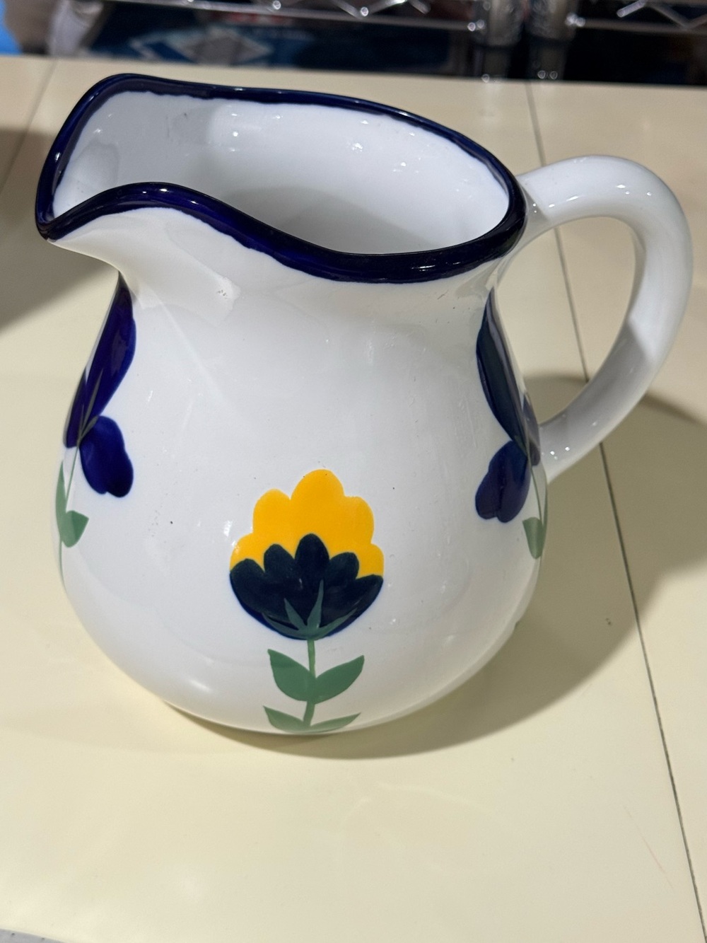 Dansk White Ceramic Pitcher with Blue and Yellow Floral Accents